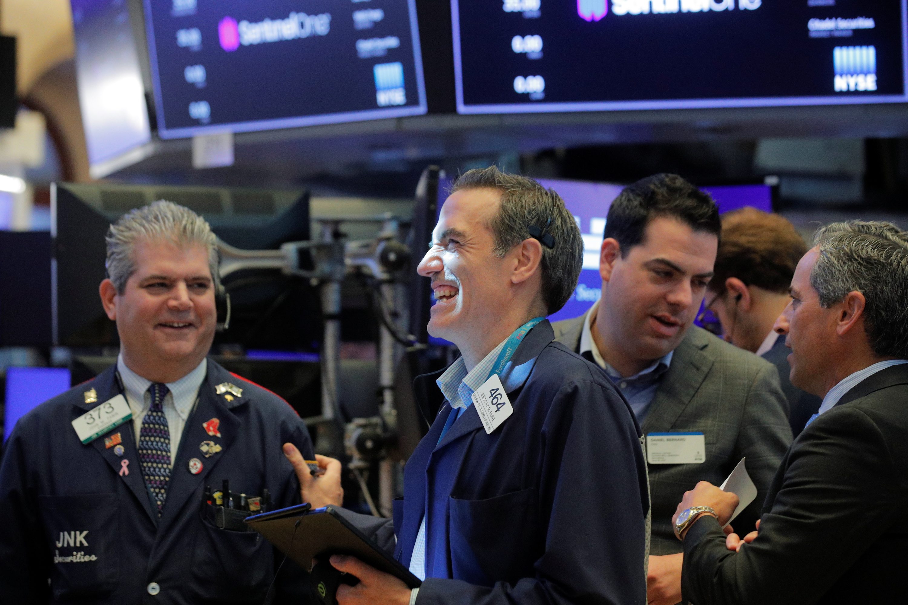 Wall Street roars to record peak on rosy earnings, dollar wilts