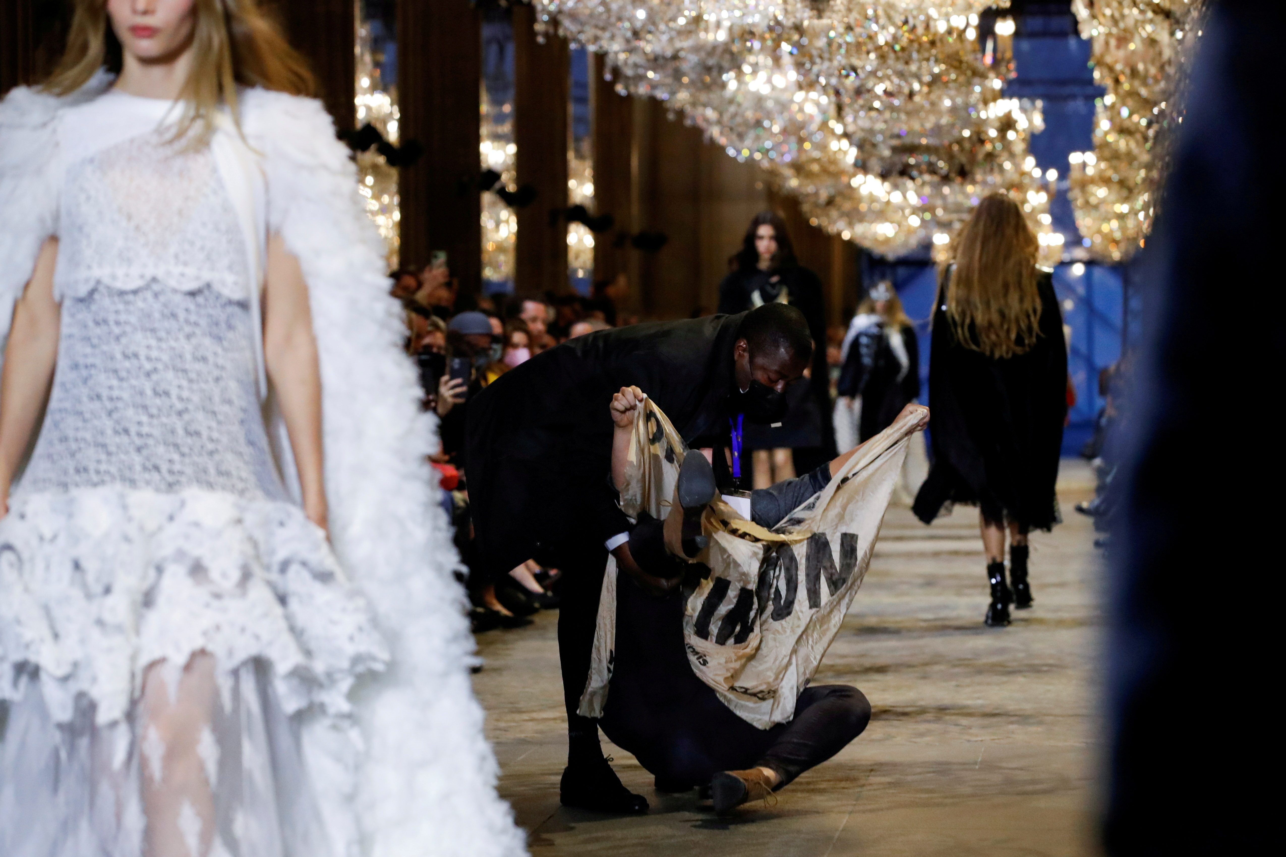 Environmental activist crashes Louis Vuitton SS22 fashion show – The Pace  Press