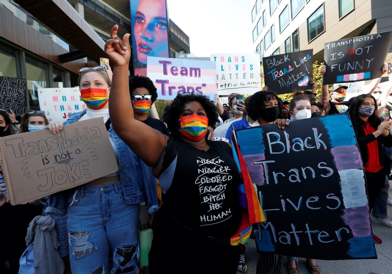Protesters denounce Netflix over Dave Chappelles transgender comments photo