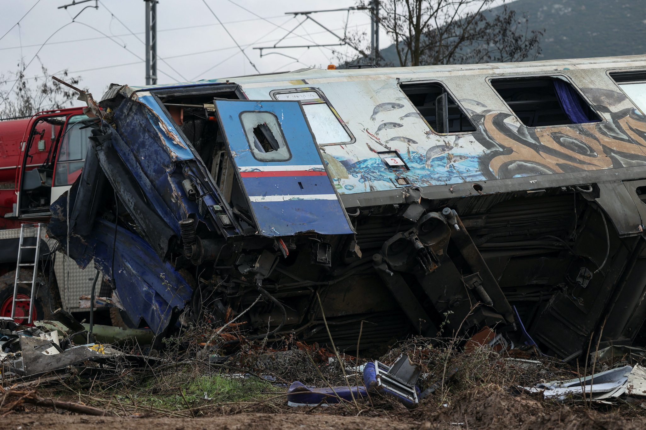 Greece to wrap up search at train crash site, grief turns to anger