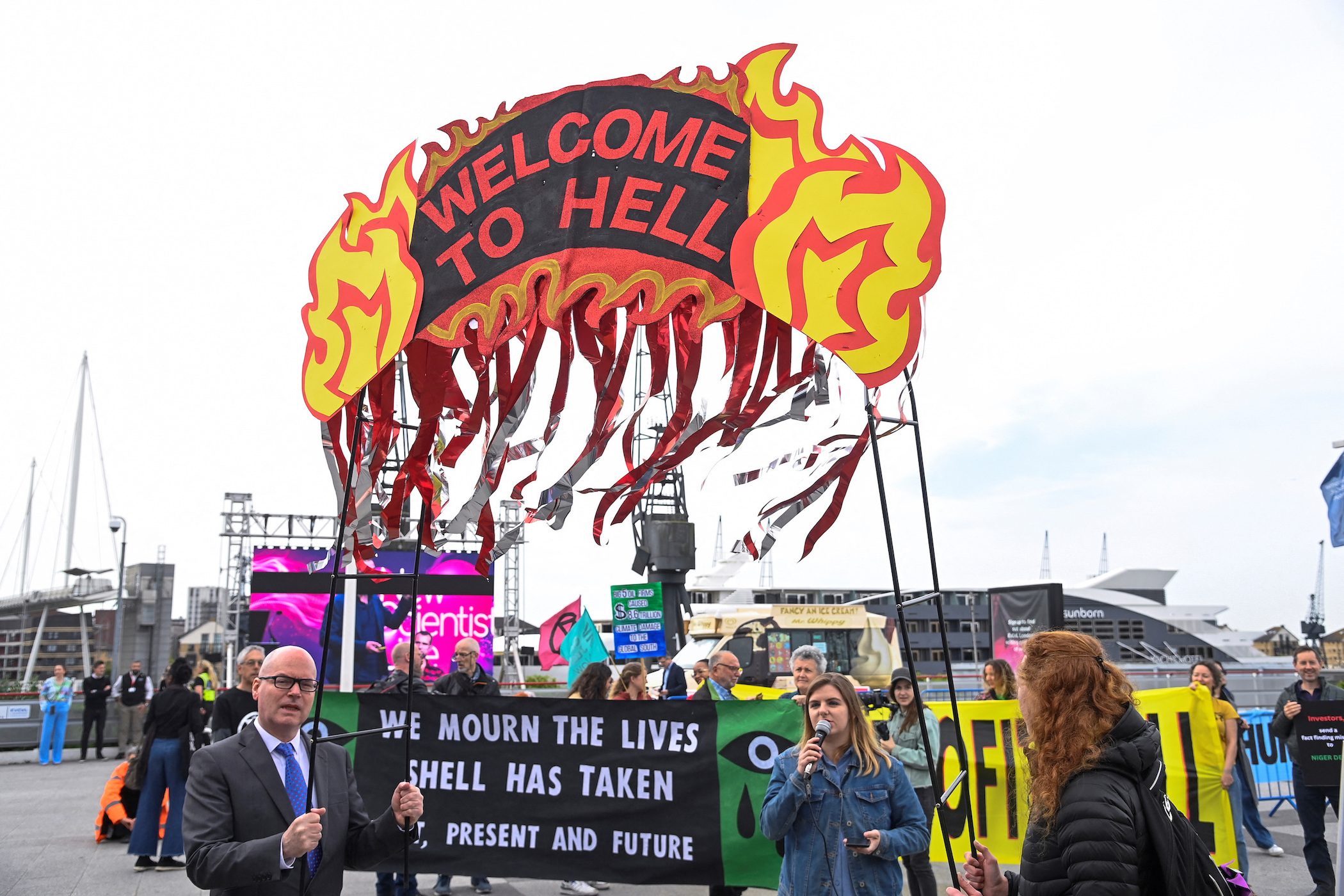 Climate activists storm Shell shareholder meeting