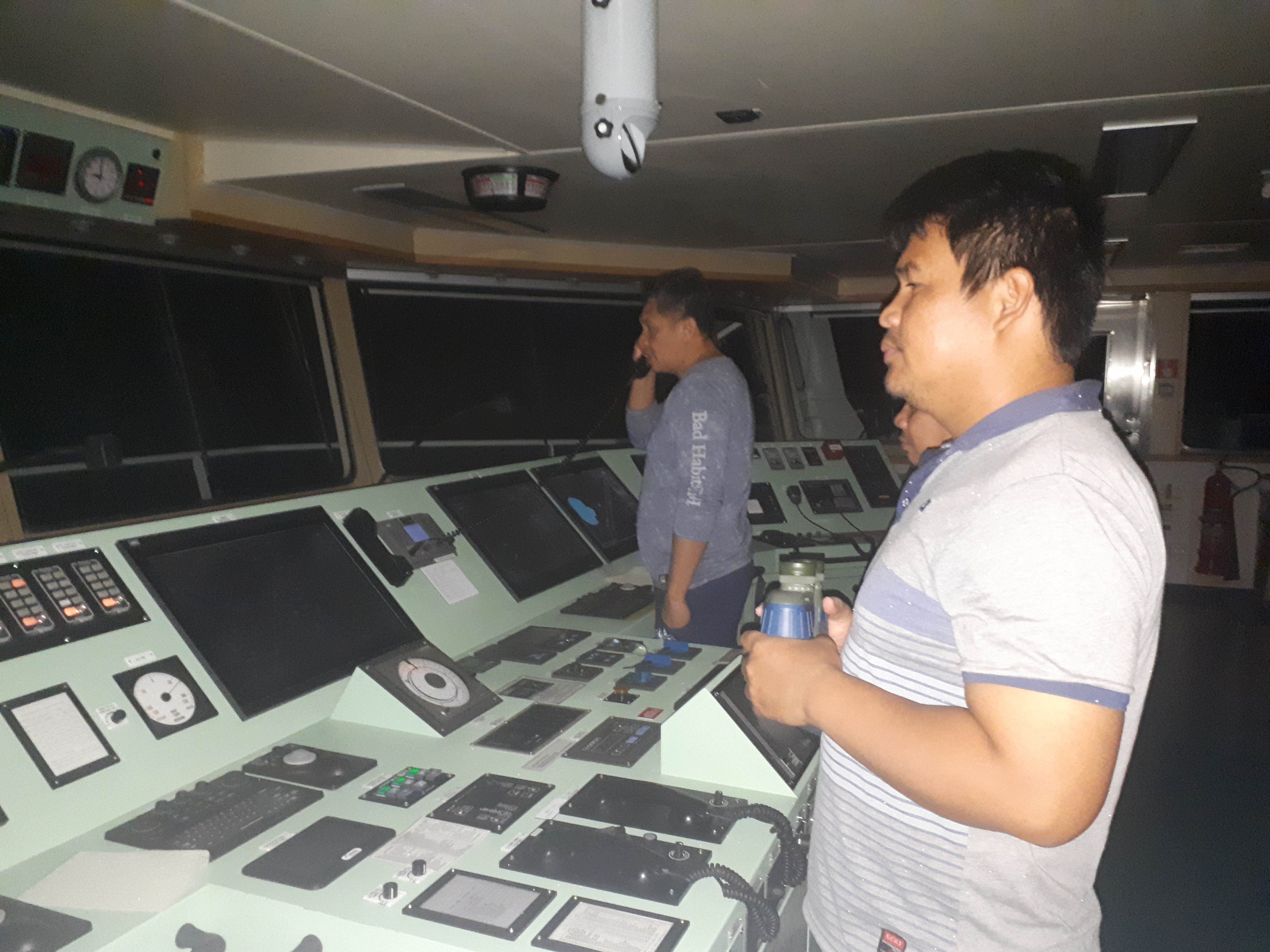 FILIPINO CREW. Ship captain Manolo Ebora (left) speaks to the crew of a 'Chinese warship' on the radio as his crew of fellow Filipinos steer the international oil tanker Green Aura near Scarborough Shoal in the West Philippine Sea on September 30, 2019. Photo courtesy of Captain Manolo Ebora