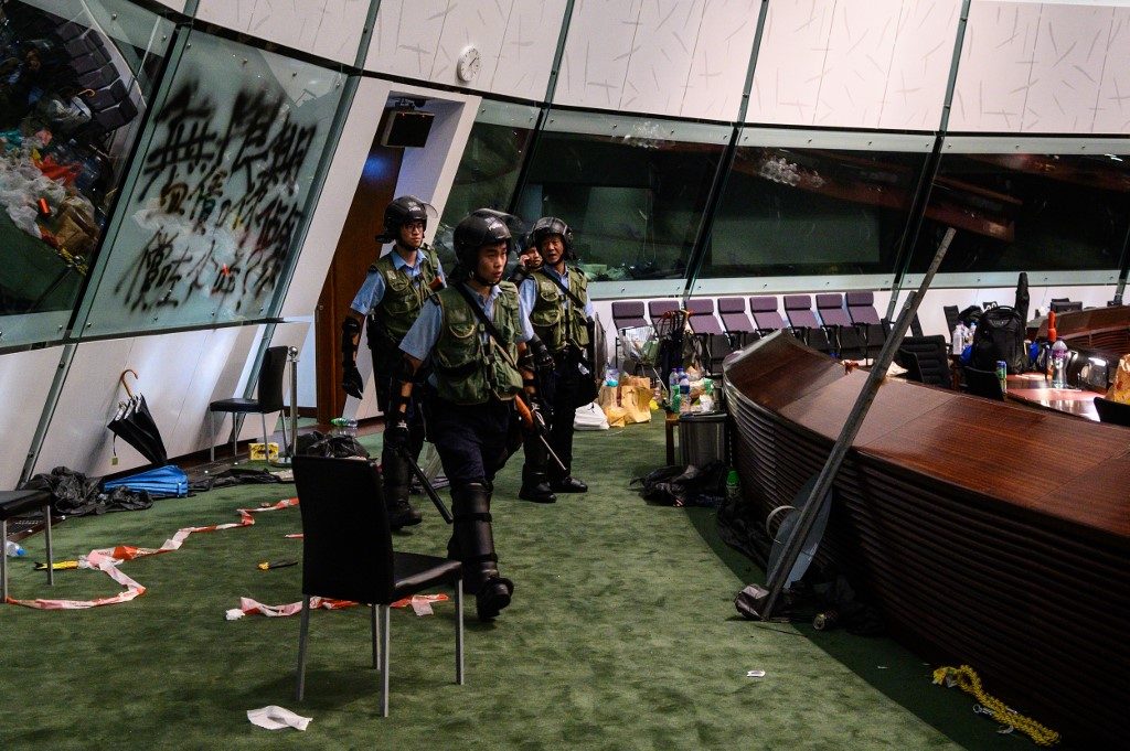 Hong Kong police vow action over parliament ransacking