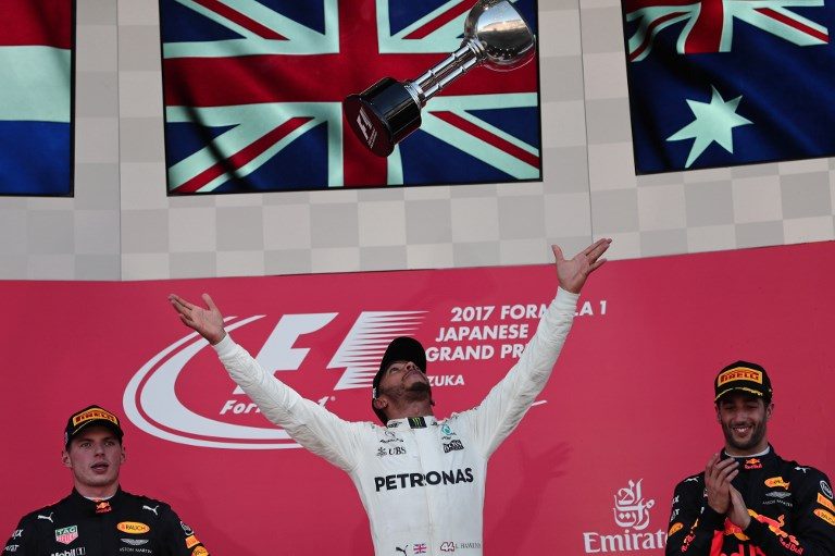 Ruthless Lewis Hamilton roars to Japan victory