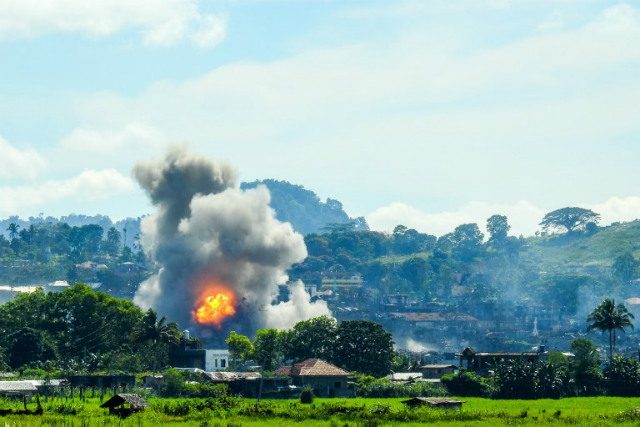 AIR STRIKES. Probably among the game-changers of the war in Marawi City were the air strikes of the Philippine Air Force. Here, smokes billows from the continuous pounding of the terrorist positions. Photo by Ferdinand Cabrera/AFP    