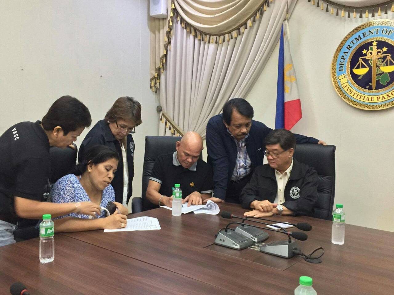 APPLICATION. Lorenza and Saldy delos Santos apply for the Witness Protection Program of the Department of Justice on August 29, 2017. With them is Justice Secretary Alexander Aguirre II and Dante Jimenez, president of the Volunteers Against Crime and Corruption (VACC). Photo courtesy of the DOJ  