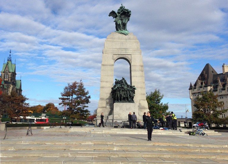 This October 22, 2014 photo shows police at the scene of a shooting at the National War Memorial in Ottawa, Canada. Michel Comte/AFP