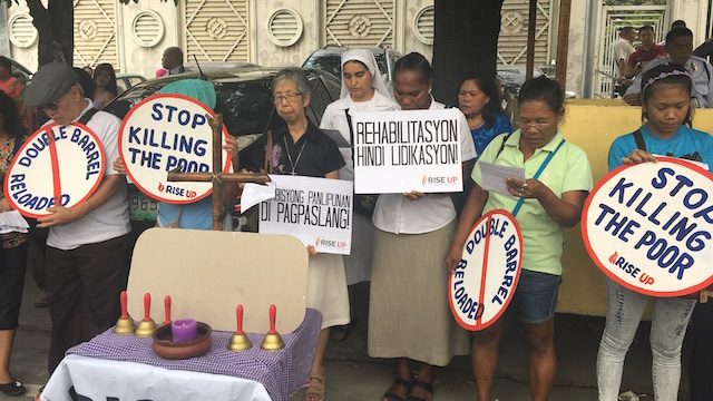 WAR ON THE POOR. Groups protest the killings in front of the Office of the Ombudsman. Rappler photo   