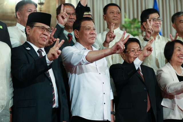 BANGSAMORO. President Rodrigo Duterte signs the landmark Bangsamoro Organic Law. Malacañang file photo 