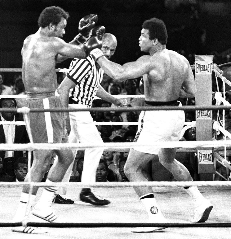 Muhammad Ali (R) "shook up the world" once again after knocking out George Foreman (L) in Kinshasa, Zaire. File photo by AFP 