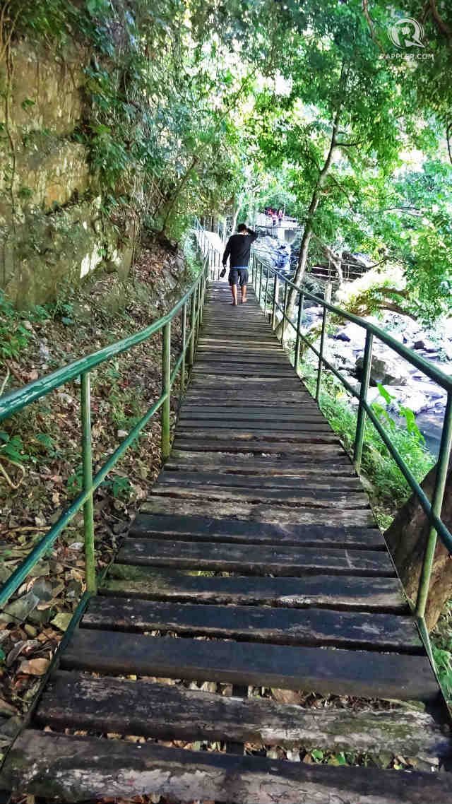 WOODEN BRIDGE. A walk on a long wooden bridge will take you to Kasabangan. 