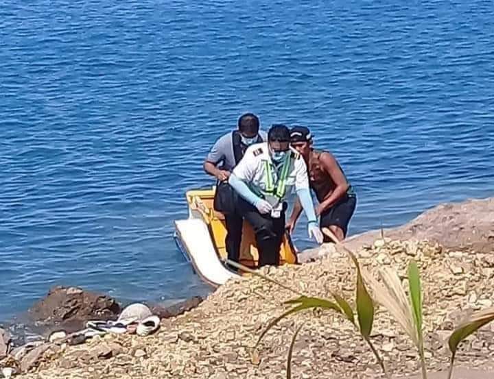 RESCUED. Two of the passengers of the training plane are brought to shore. Photo from CAAP 