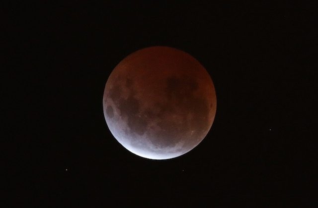 Pacific Rim sky-gazers witness ‘unusually brief’ lunar eclipse